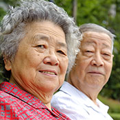 Smiling older Asian couple
